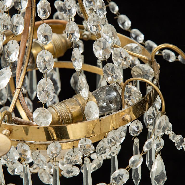 A small Swedish 20th century empire style chandelier for three candles.