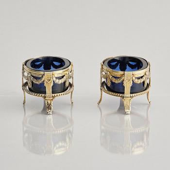 A pair of Swedish 18th century silver and blue glass salt cellars, mark of Pehr Zethelius, Stockholm 1775.