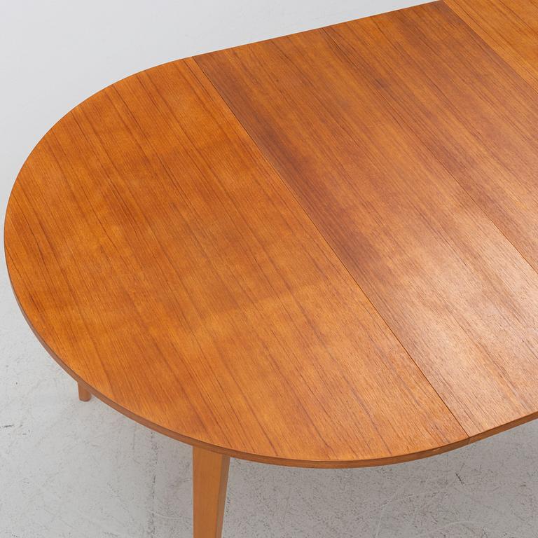 A teak-veneered dining table, mid 20th century.