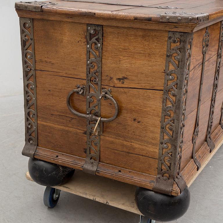 A 18th century baroque oak chest with iron mountings.