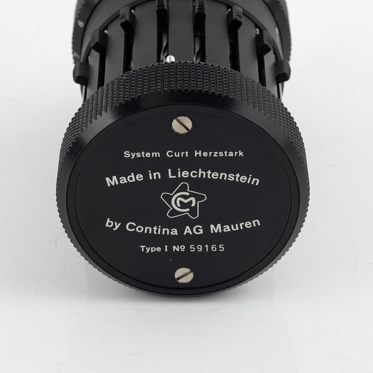 A Curta Type I mechanical calculator.