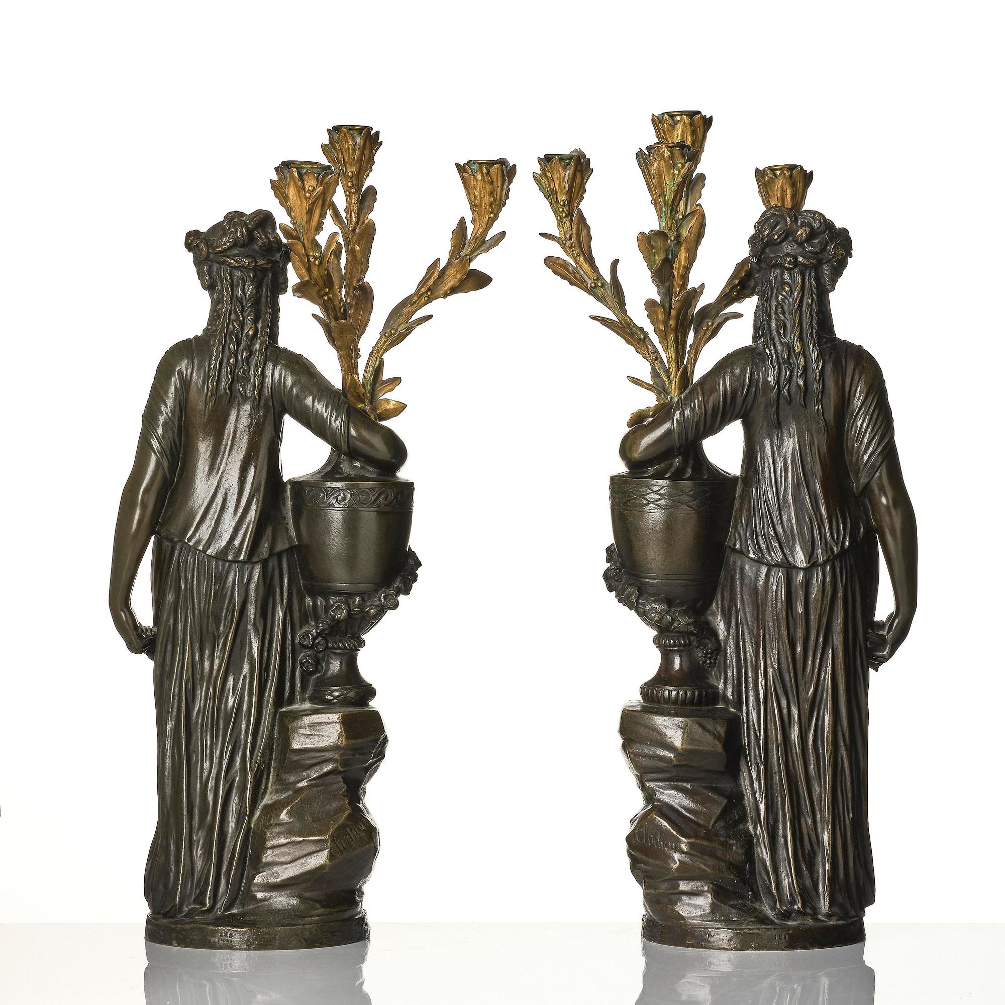 A pair of Louis XVI-style four-light gilt and patinated bronze candelabra after Clodion, later part 18th century.