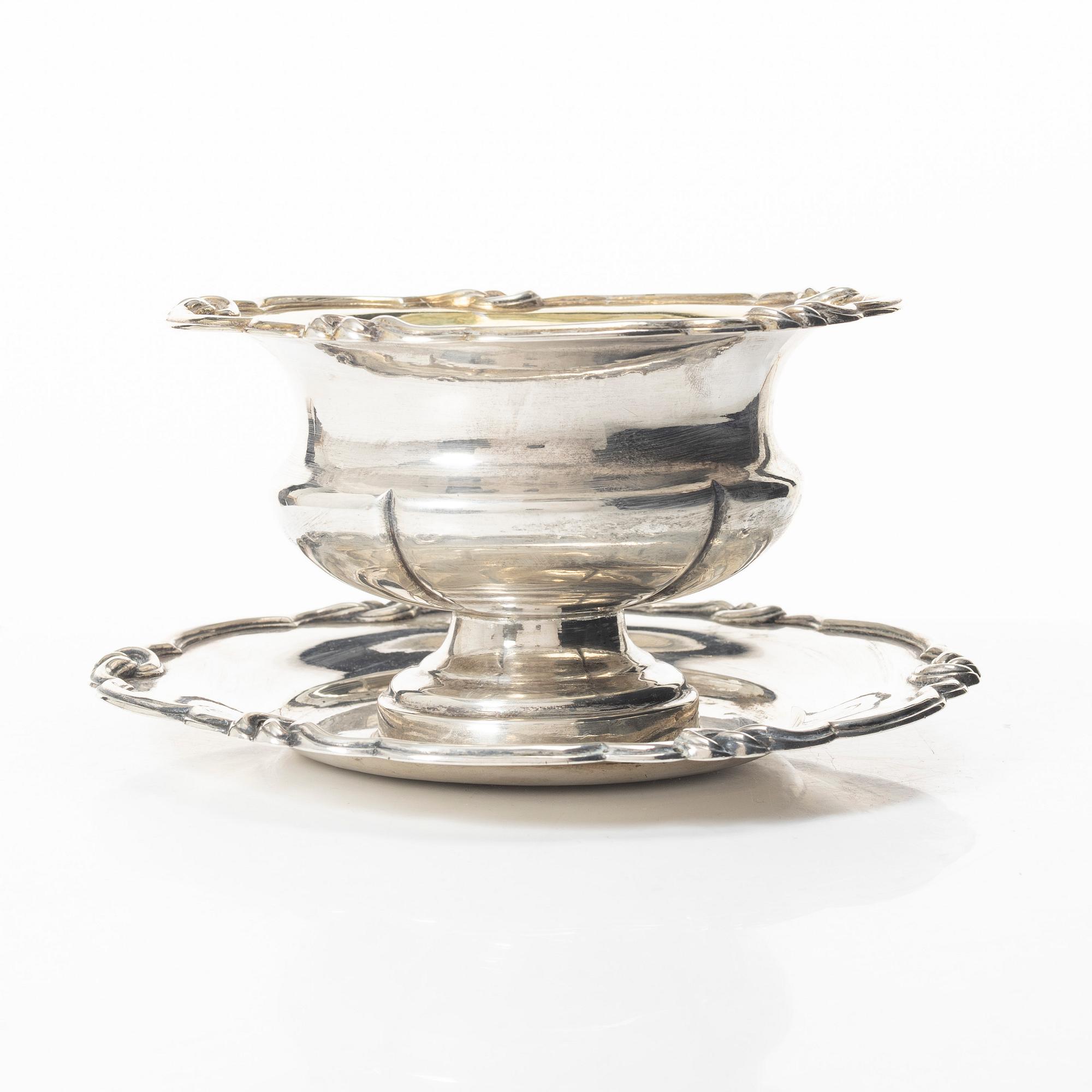 Gustaf Möllenborg, a silver bowl, Stockholm 1851, six silver punch cups, including CG Hallberg, and a silver spoon.