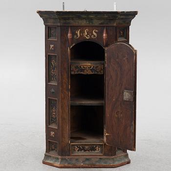 A Swedish painted corner cupboard, 18th Century.