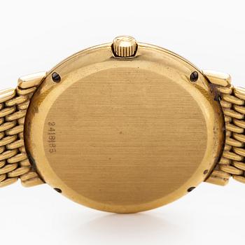 IWC (International Watch Co.), 31 mm, 18K gold, quartz.