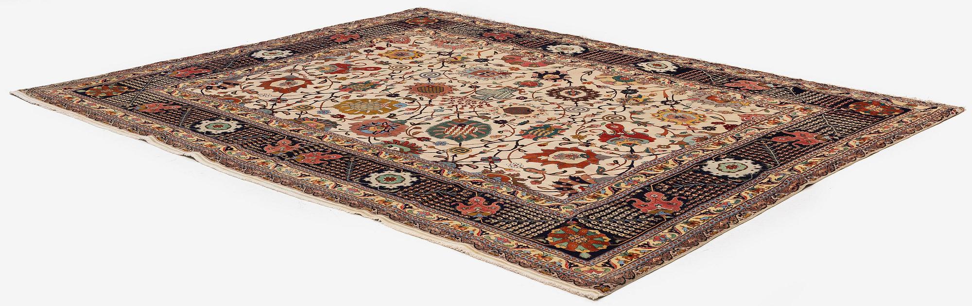 A semi-antique Tabriz carpet, Northwest Persia, of Safavid 'Vase' design, c.328 x 242 cm.