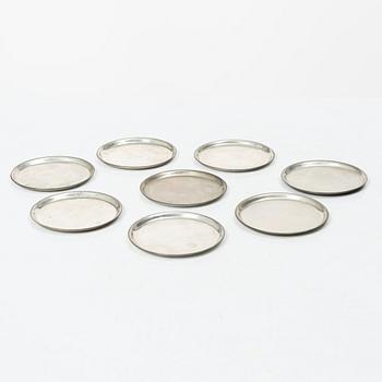 Eight coasters, silver 900, 20th century.
