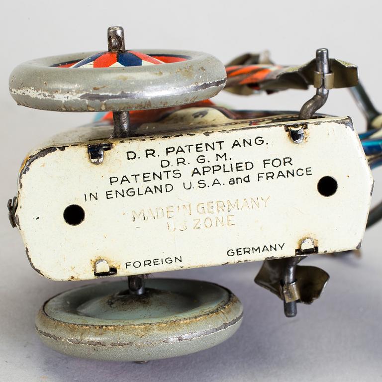 A lot of three tinplate toys Japan and Germany 1950s.