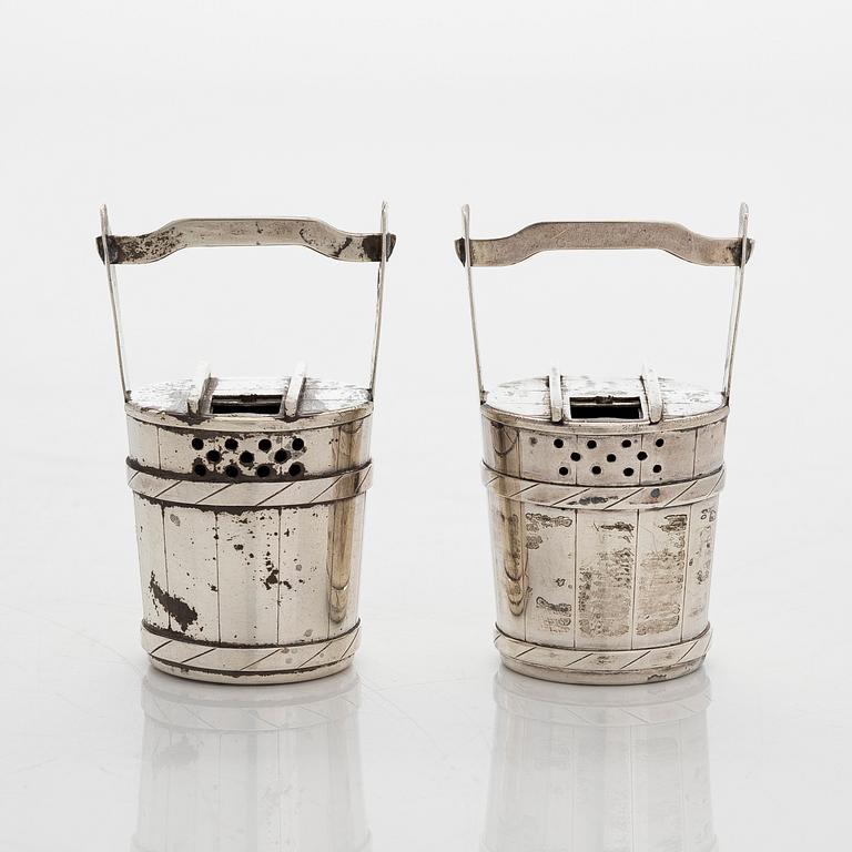 A pair of sterling silver salt- and pepper shakers , Japan, latter half of the 20th century.