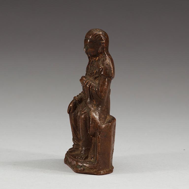 A seated copper-alloy figure of a the God of War, Guan Di, Ming dynasty (1368-1644).