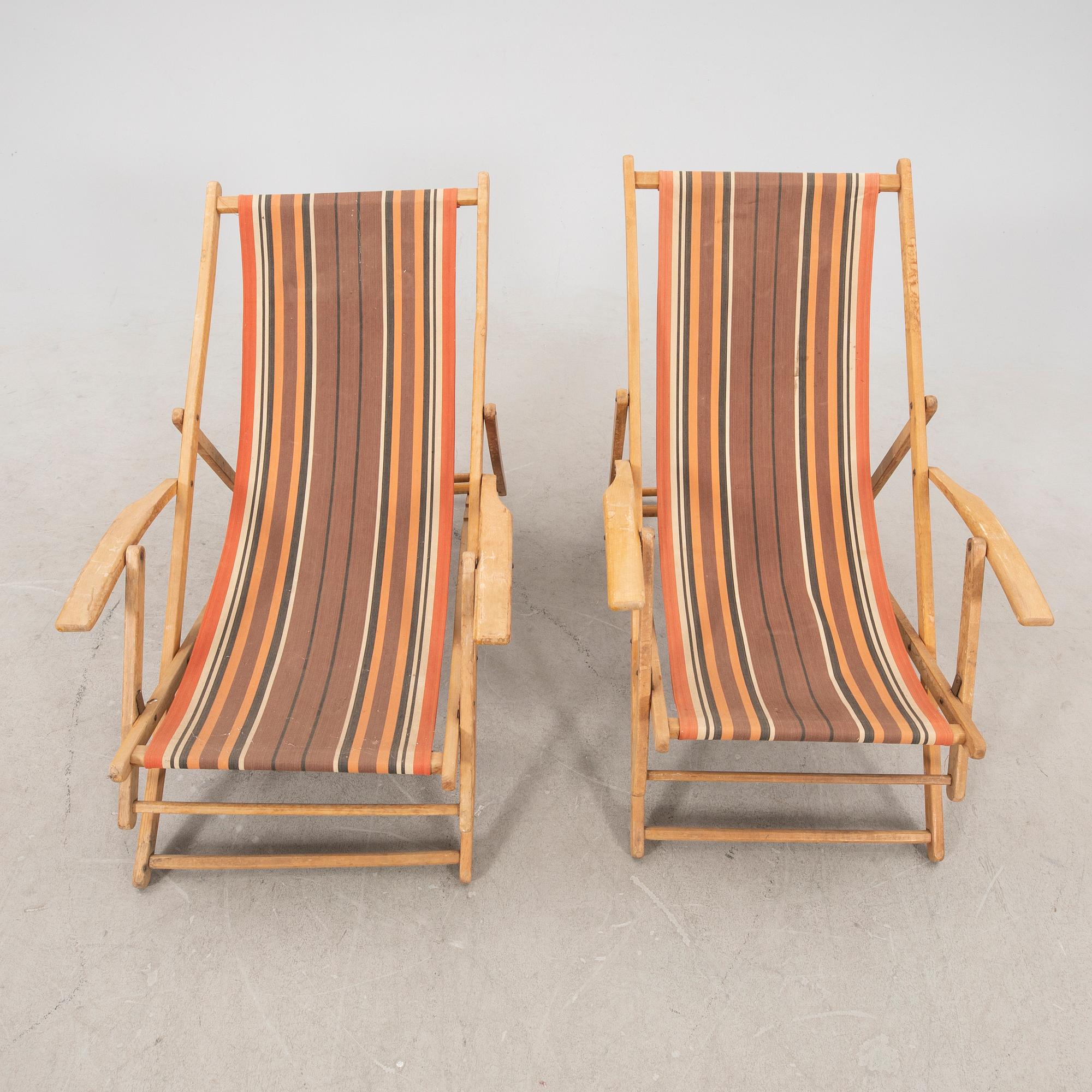 A pair of mid 1900s sun chairs.