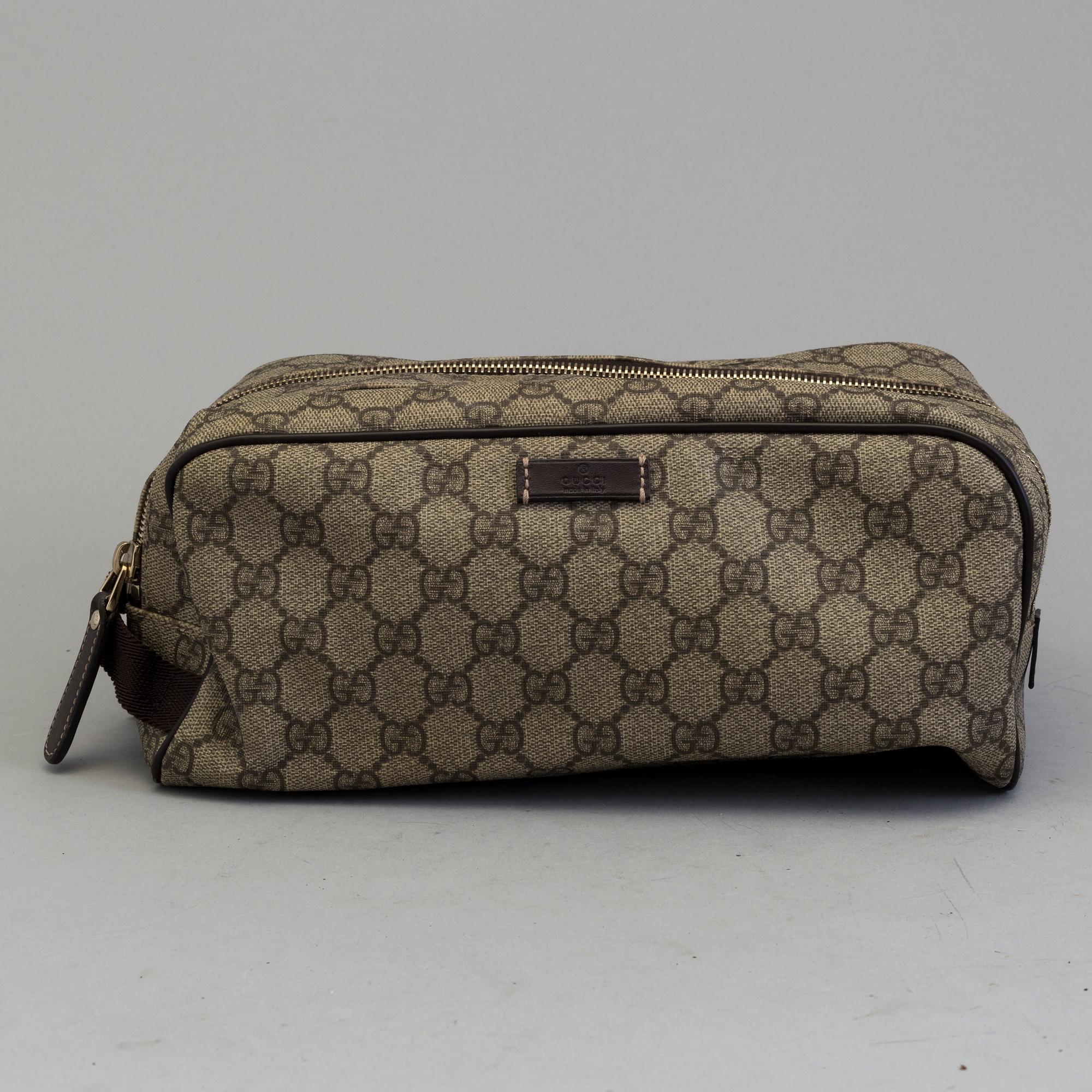 GUCCI, a monogram beauty bag.