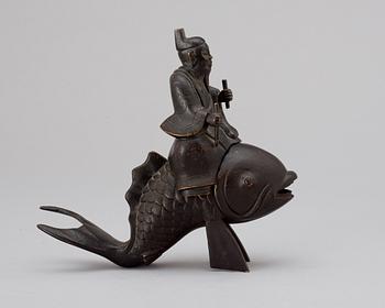 A Japanese Meiji bronze figure, Kinko on a carp.