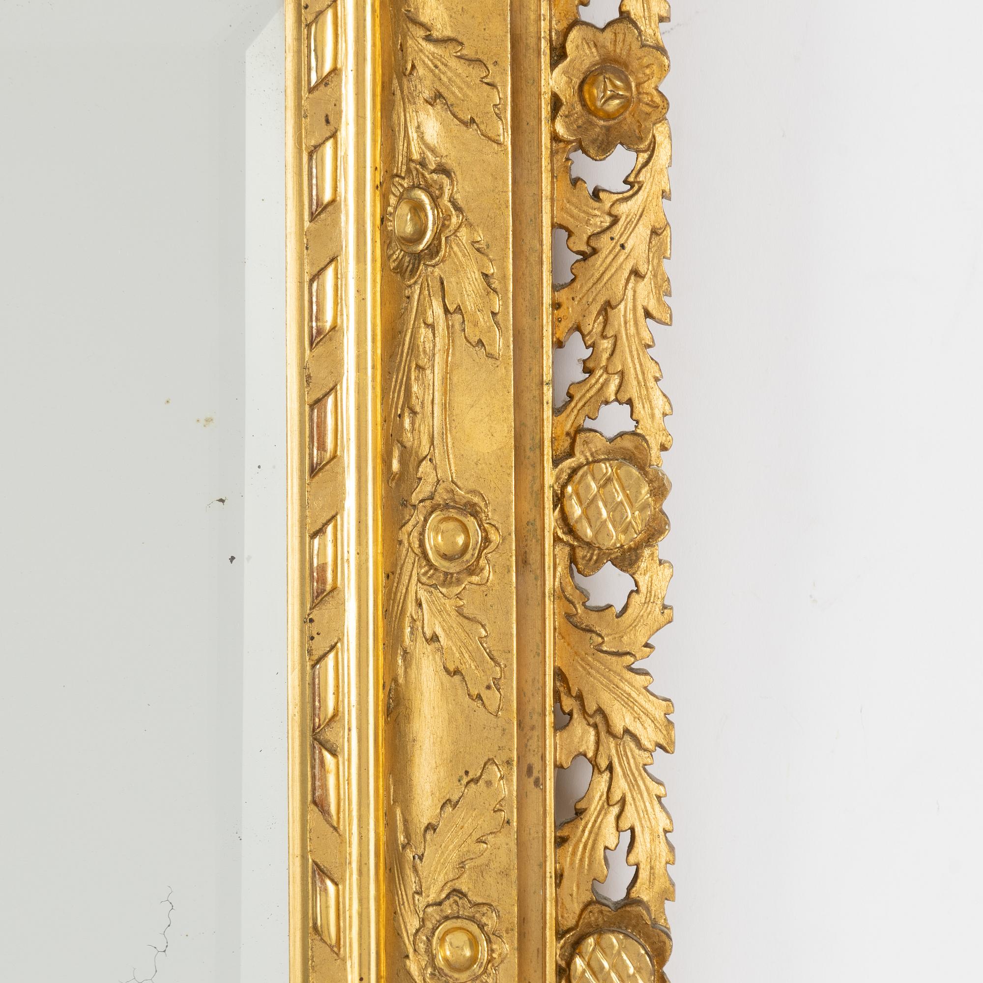 A 20th century Baroque style mirror.