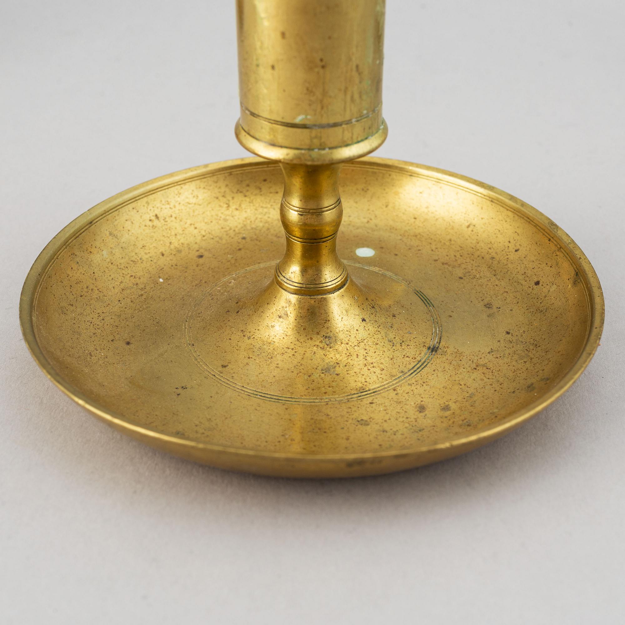 A set of six 19th-century brass candlesticks.