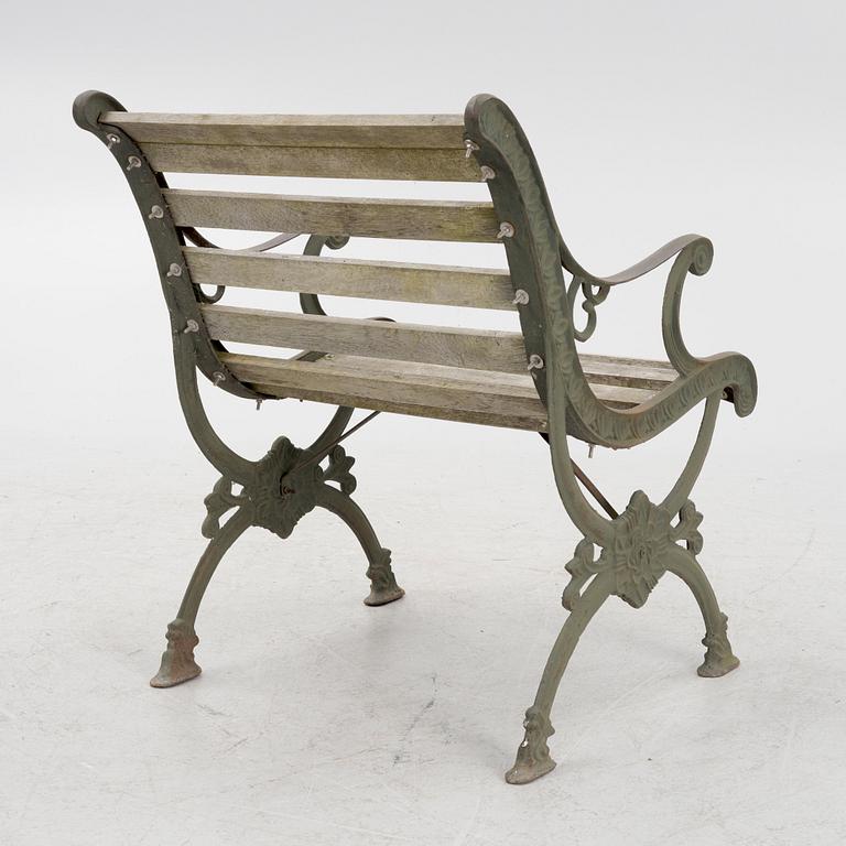 A cast-iron frame garden chair, 20th century.