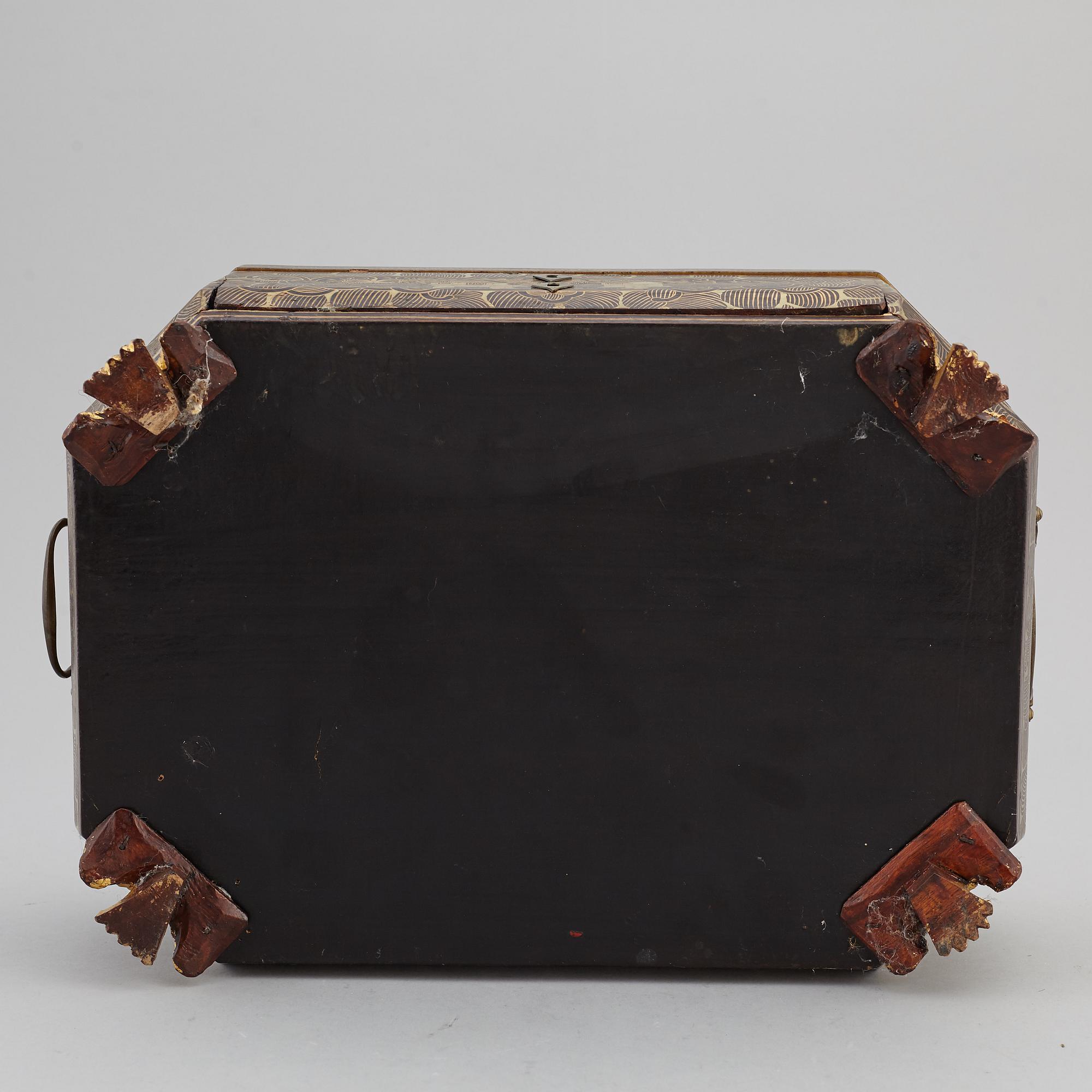 A lacquered sewing cabinet, Qing dynasty, 19th century.