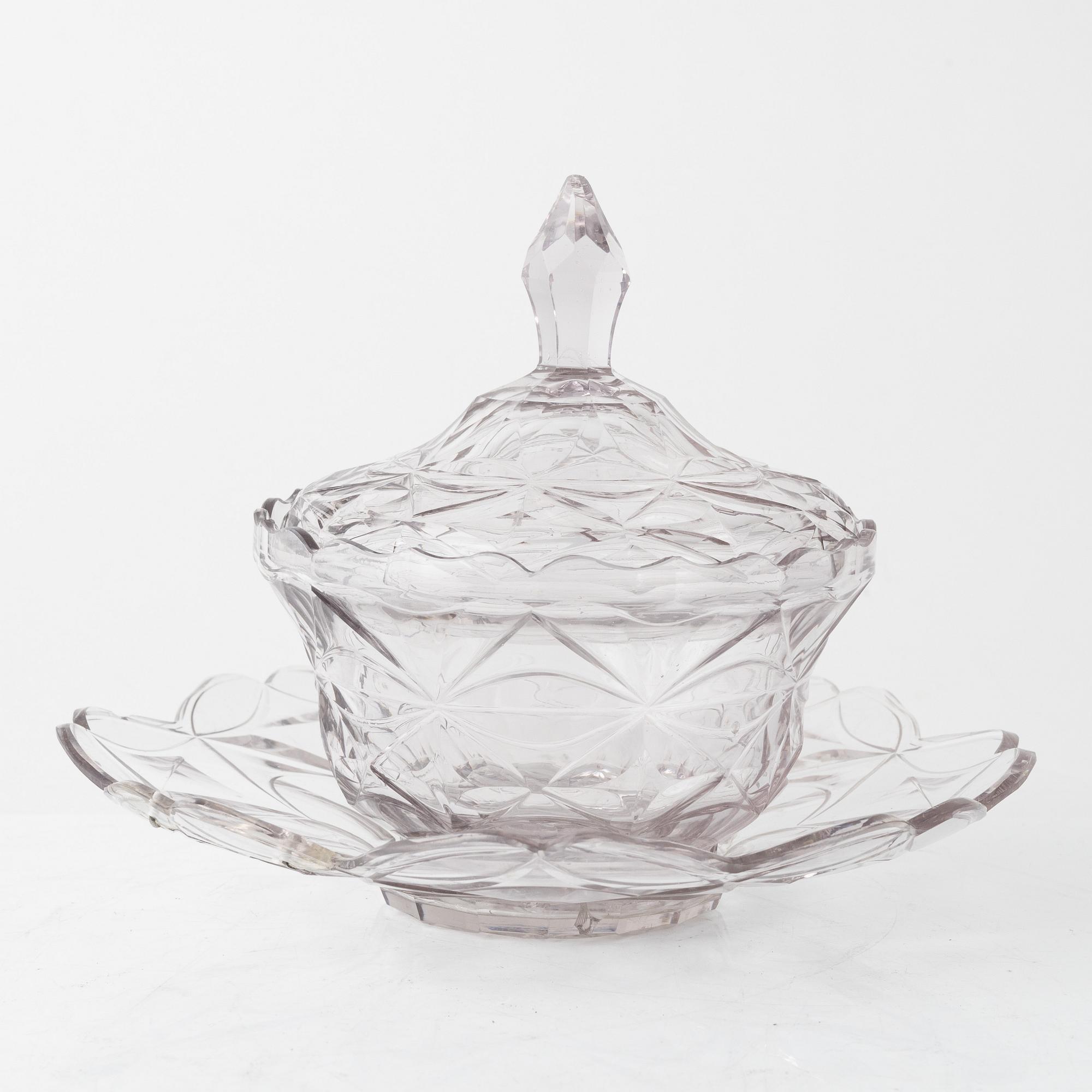 A pair of lidded glass bowls with stands, late 19th century.