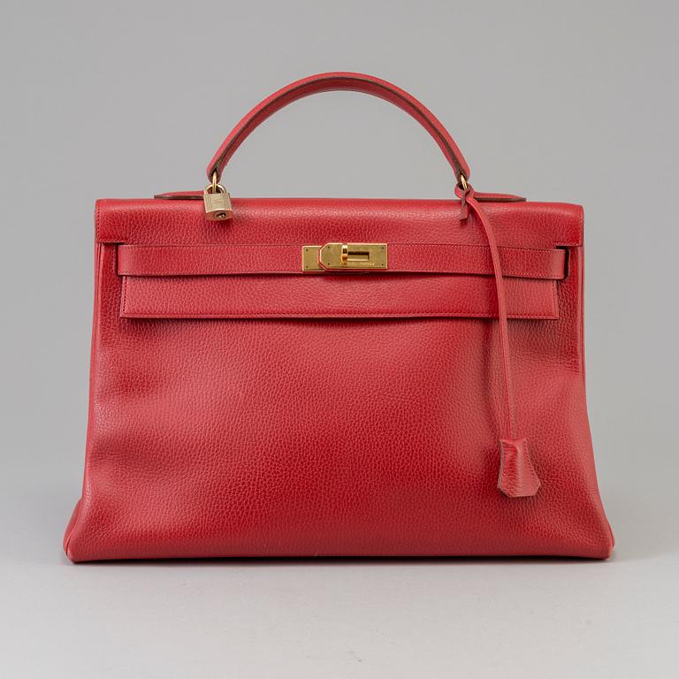 A red Epson "Kelly 40" bag by Hermès 1991.