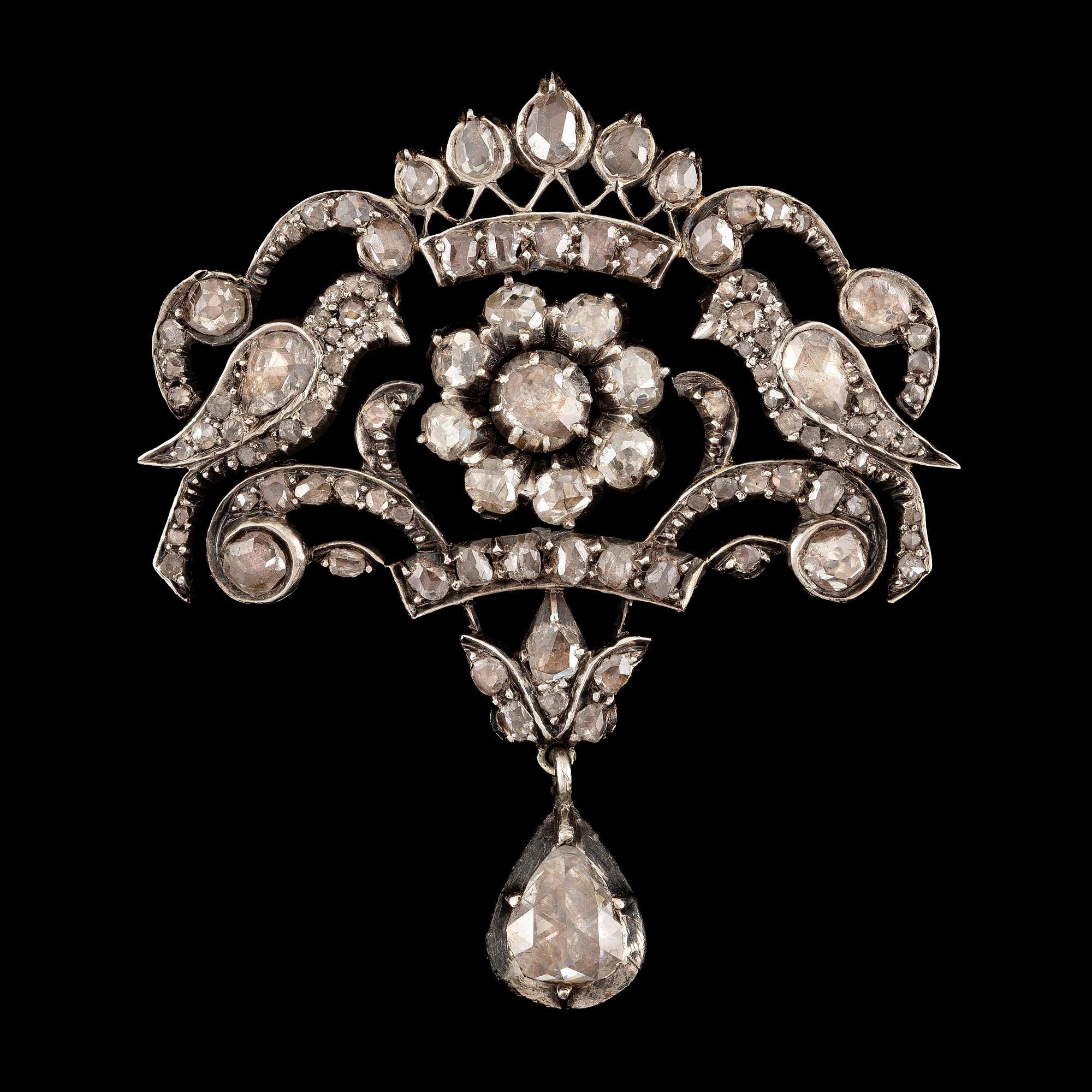 A brooch in silver and 14K gold with rose-cut diamonds.
