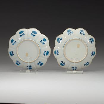 Two blue and white dishes of lotus shape decorated with flowers and insects, Qing dynasty, Kangxi (1662-1722).