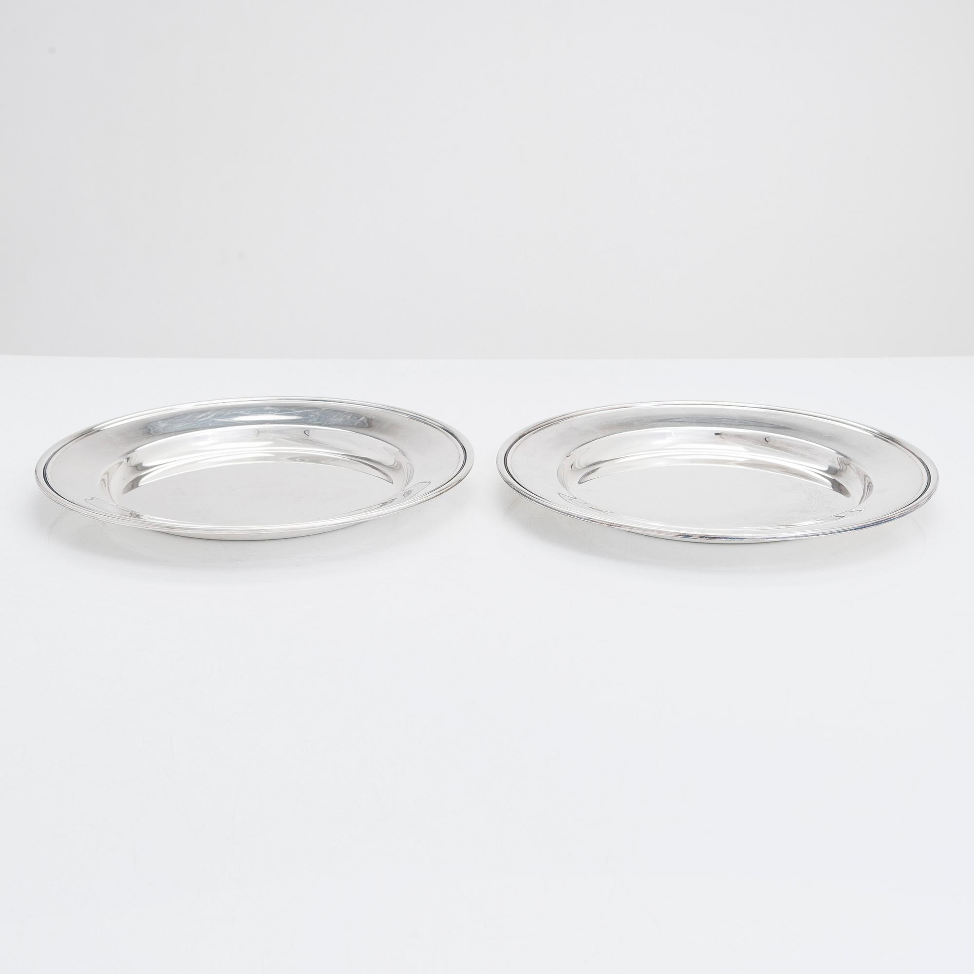 A 12-piece set of silver chargers, makers' marks of Hugo Grün, S.H. Jörgensen..., Denmark, around mid-20th century.
