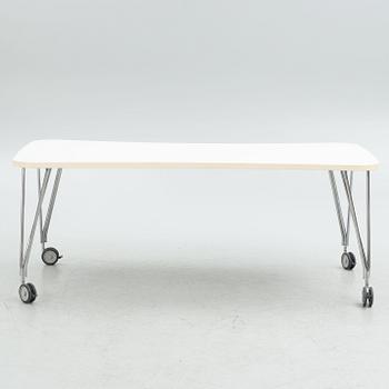 A contemporary table on wheels.