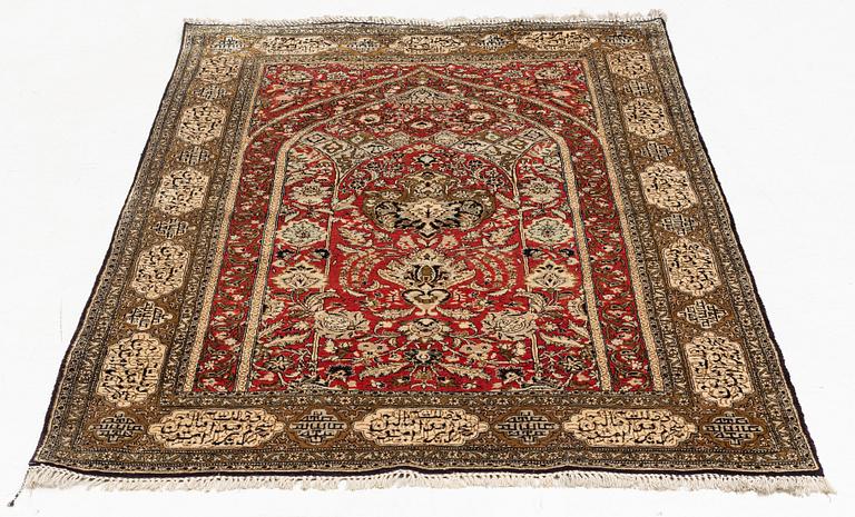 A rug, silk Quum, ca 174 x 103 cm.