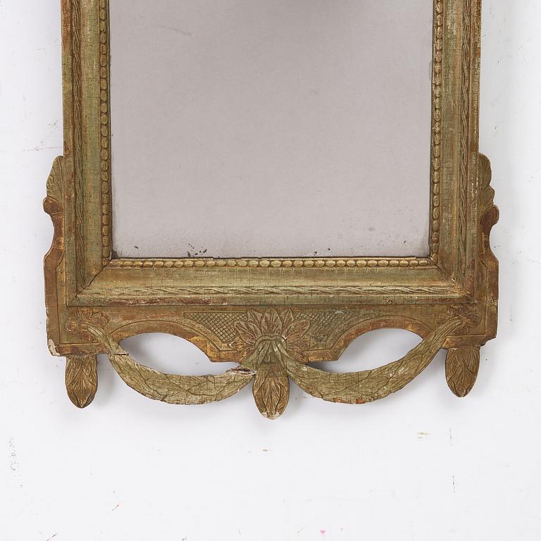 A Gustavian giltwood mirror, Stockholm, late 18th century.