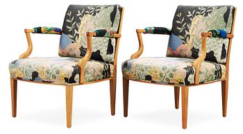 A pair of Josef Frank mahogany and ratten armchairs, Svenskt Tenn, model 969.