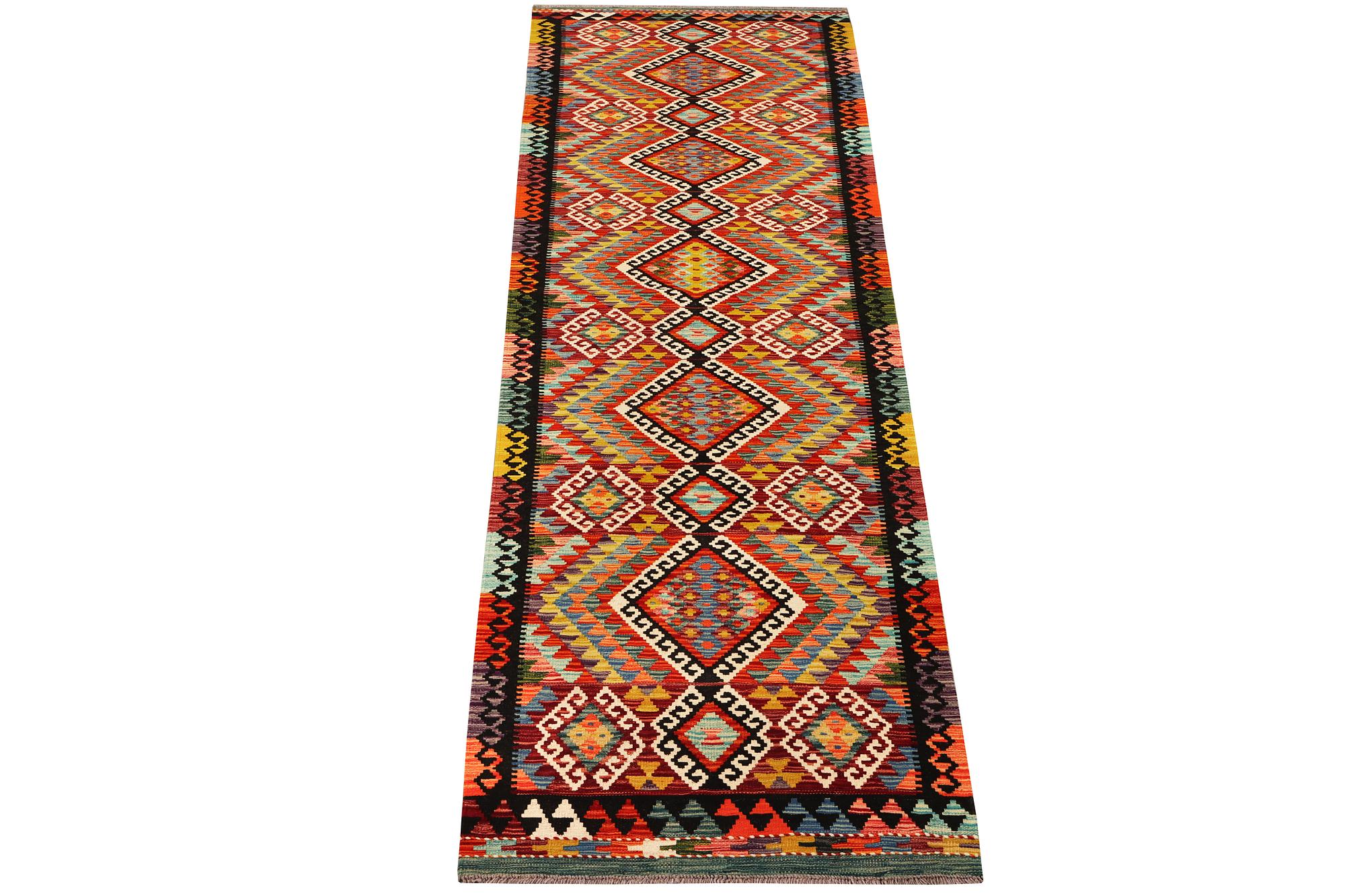 An Afghan Kelim runner, c. 384 x 83 cm.
