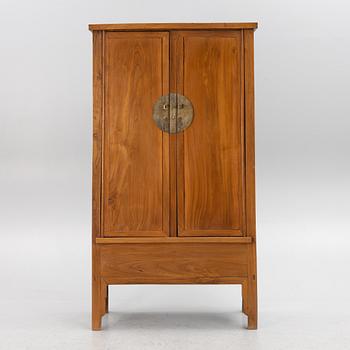 A Chinese hardwood cabinet, 20th century.