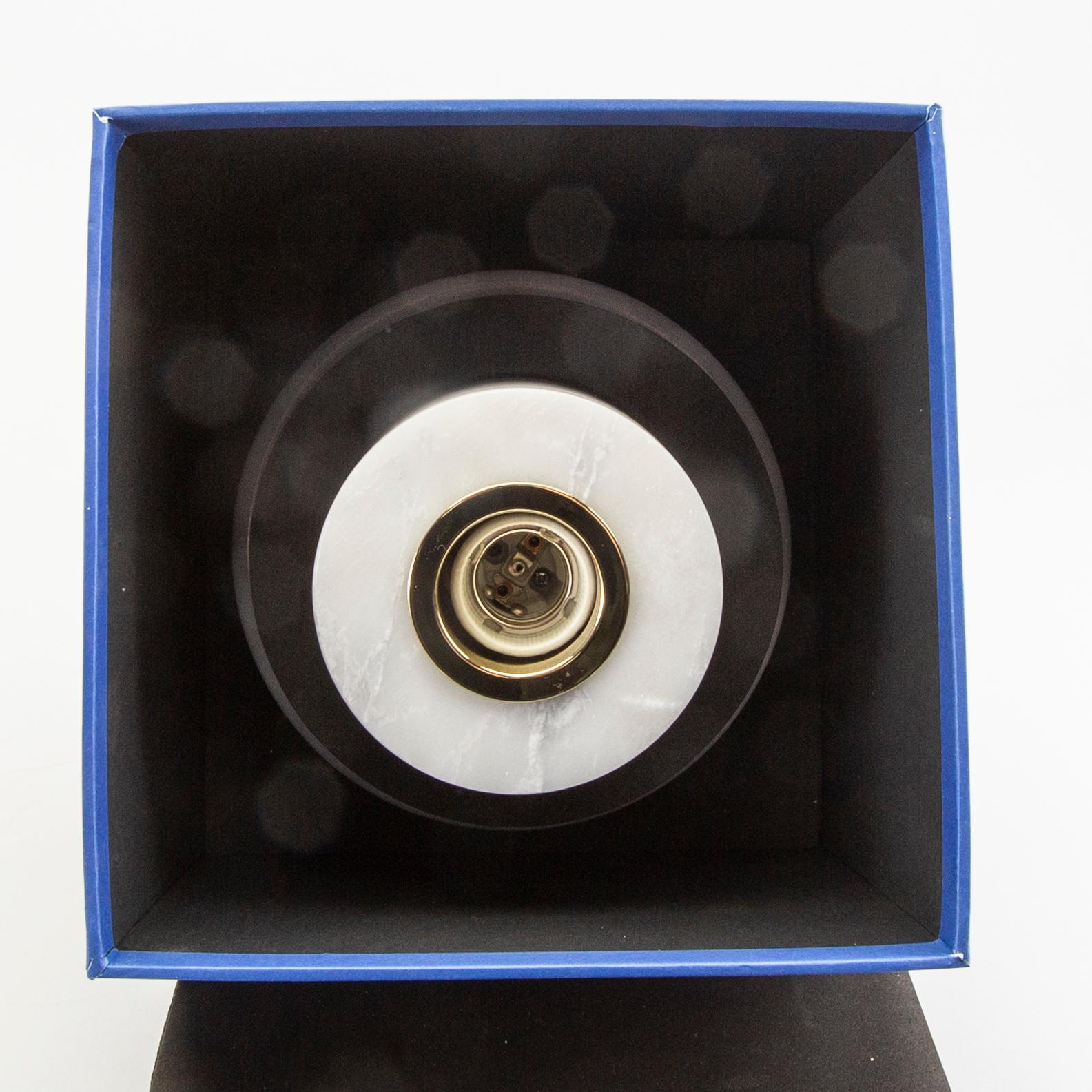 A pair of Tom Dixon wall/ceiling lamps 'Stone wall'.