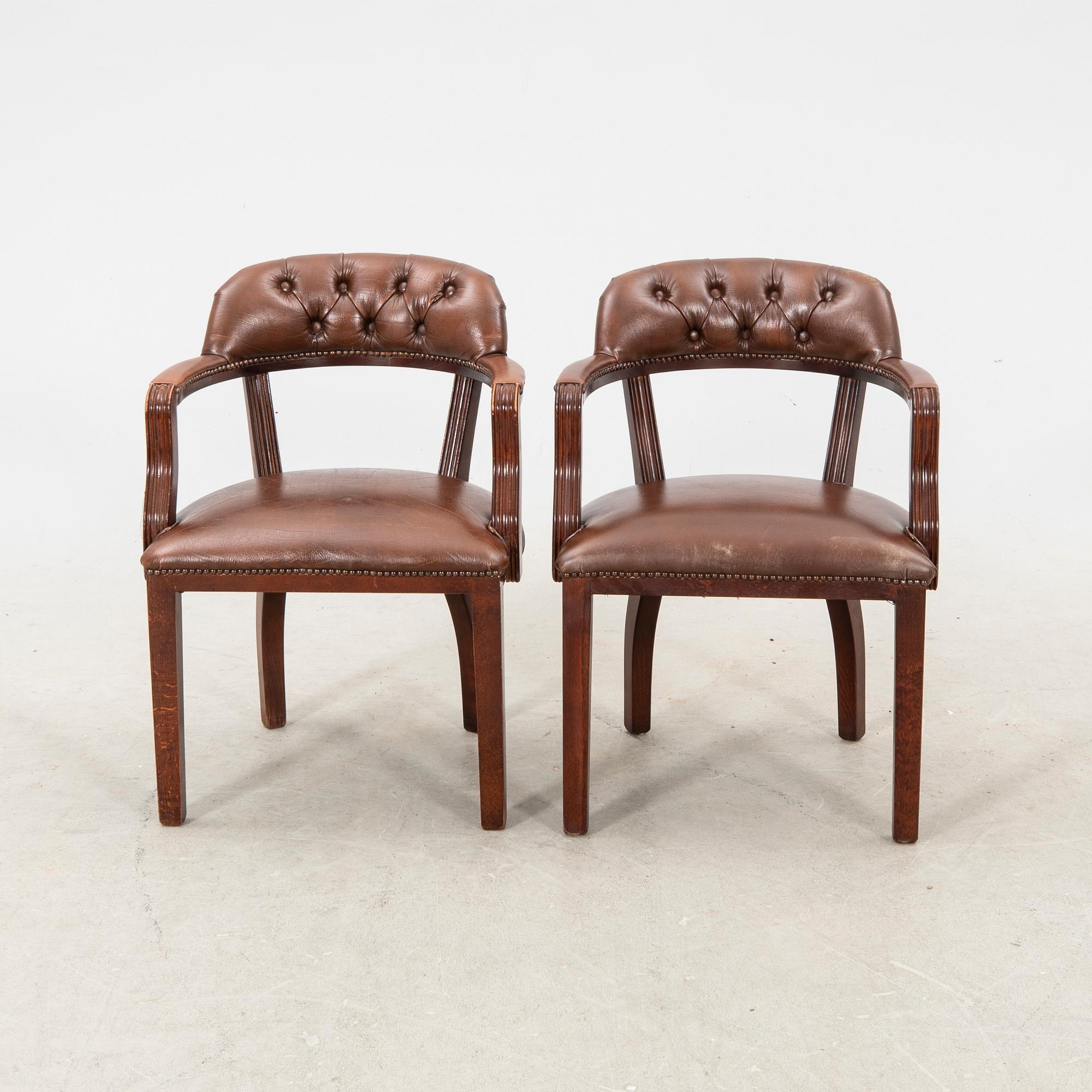 A pair of leather armchairs from the second half of the 20th century.