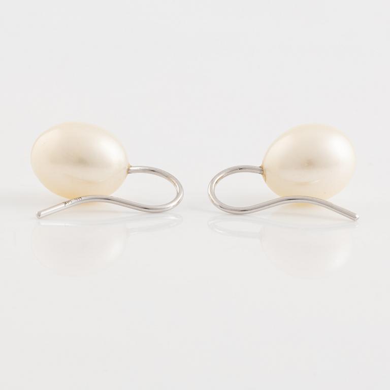 A pair of white gold earrings with cultured pearls.