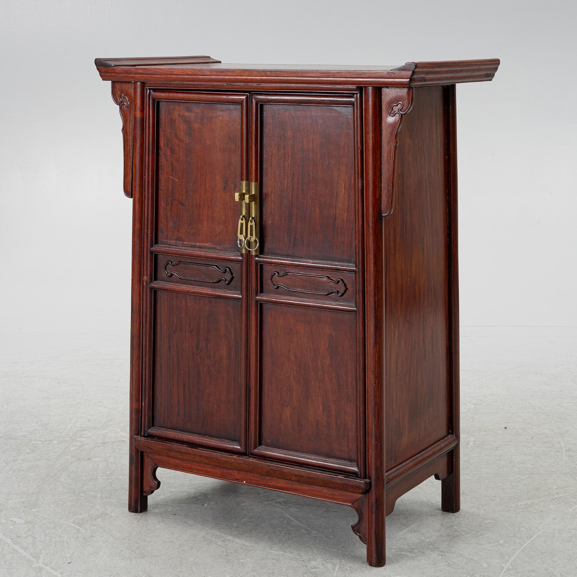 A small Chinese wooden cabinet, 1900s.