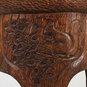 A Gustav Fjaestad Art Nouveau carved pine table by Adolf Swanson, Arvika, Sweden 1908.