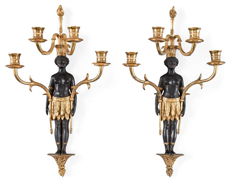 A pair of Empire-style circa 1900 four-light wall-lights.