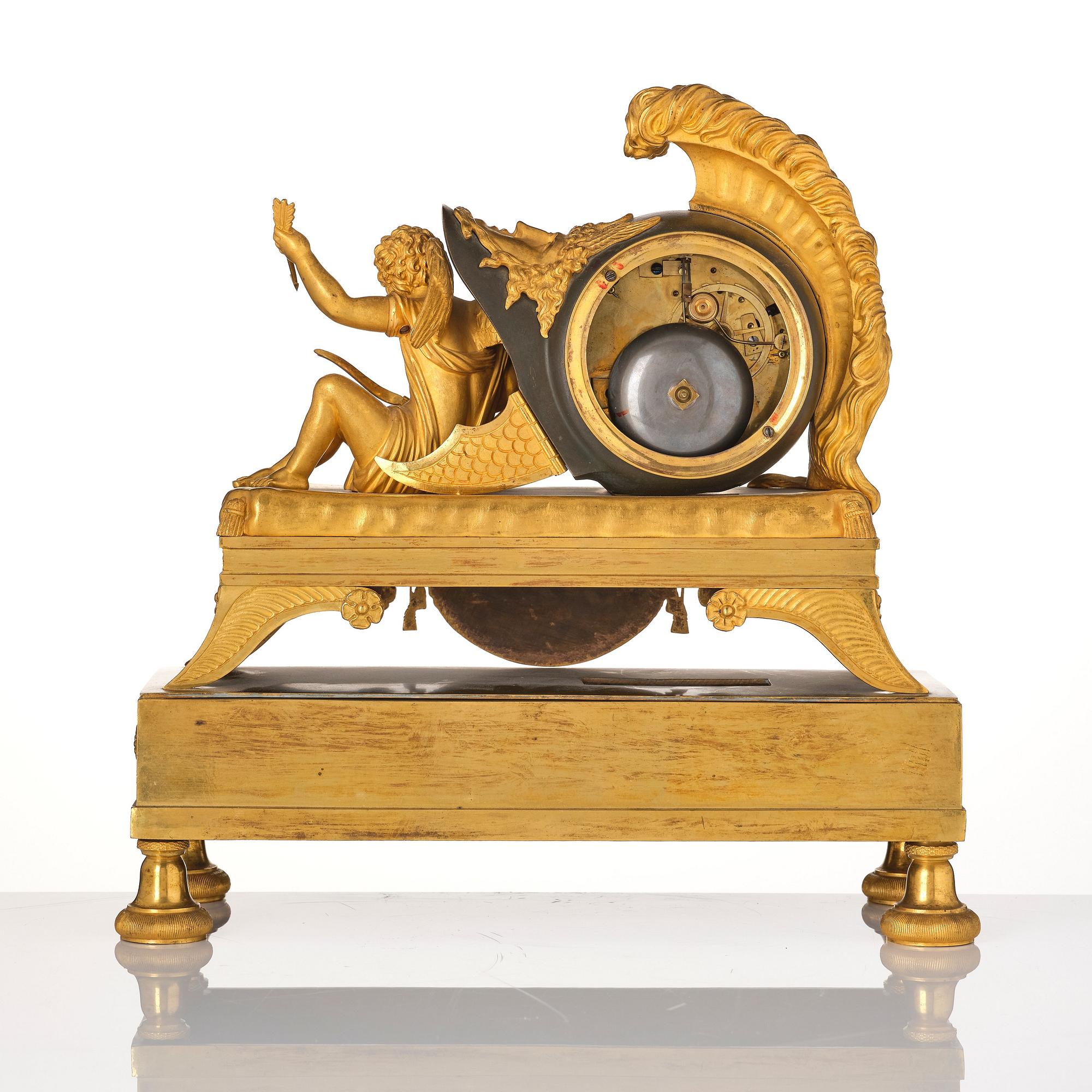 A French Empire sculptural ormolu and patinated bronze mantel clock, early 19th century.
