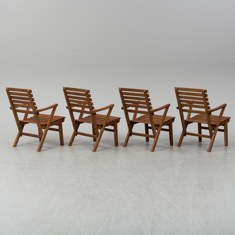 A Carl Malmsten "Bergshamra" garden table and four chairs, first half of the 20th century.