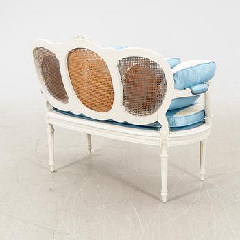 A painted rattan Louis XVI style sofa first half of the 20th century.