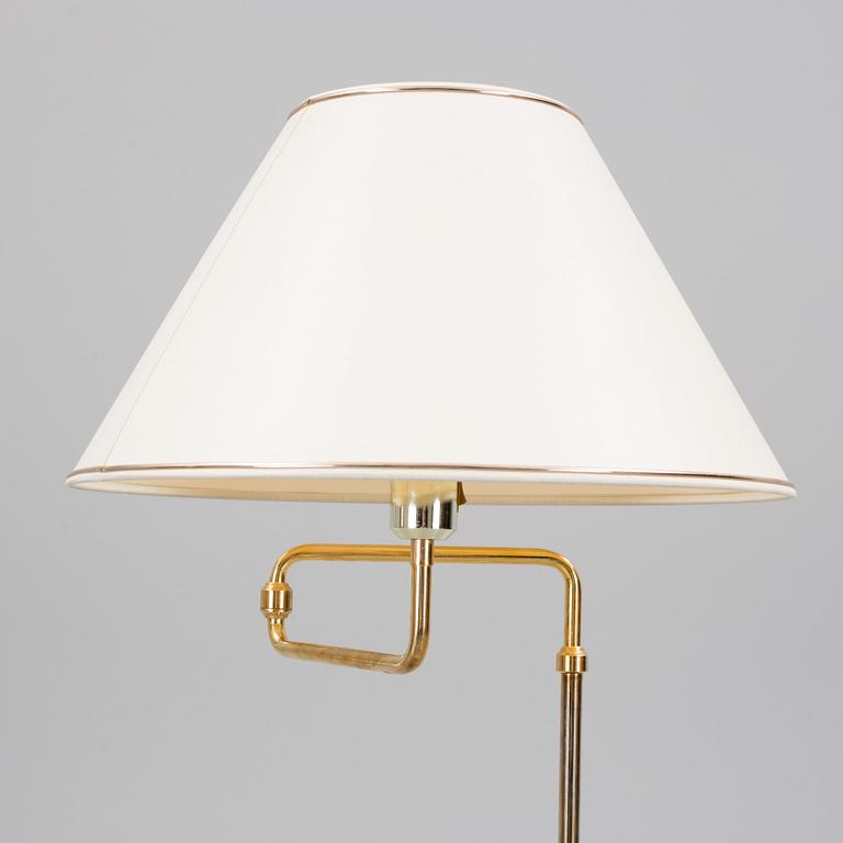 A second half of the 20th century brass wall light and a table light.