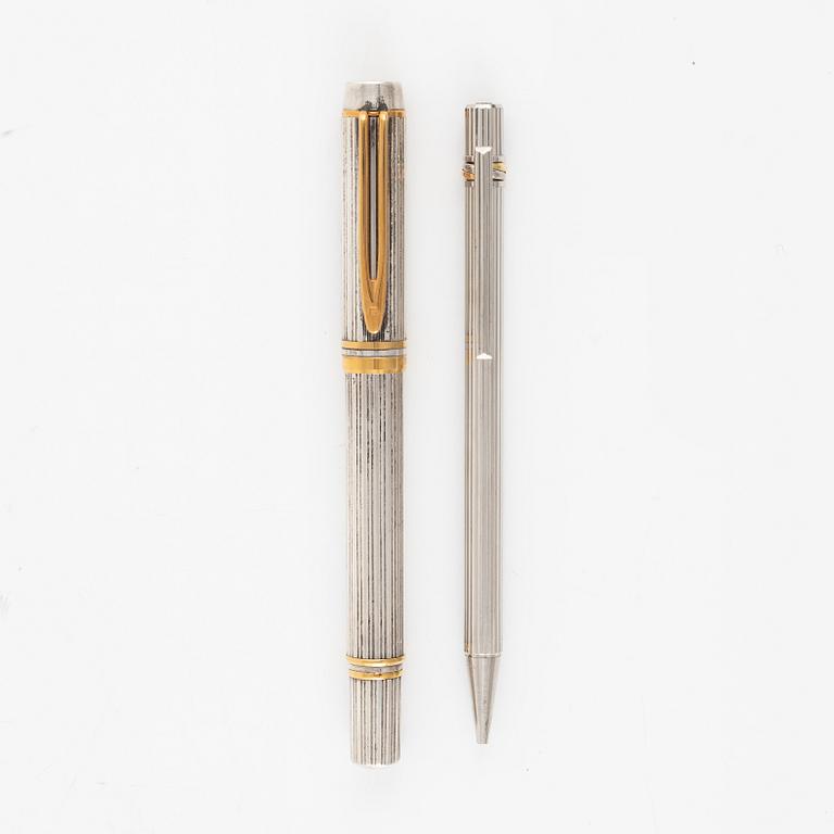 Two pens, Waterman and Cartier.
