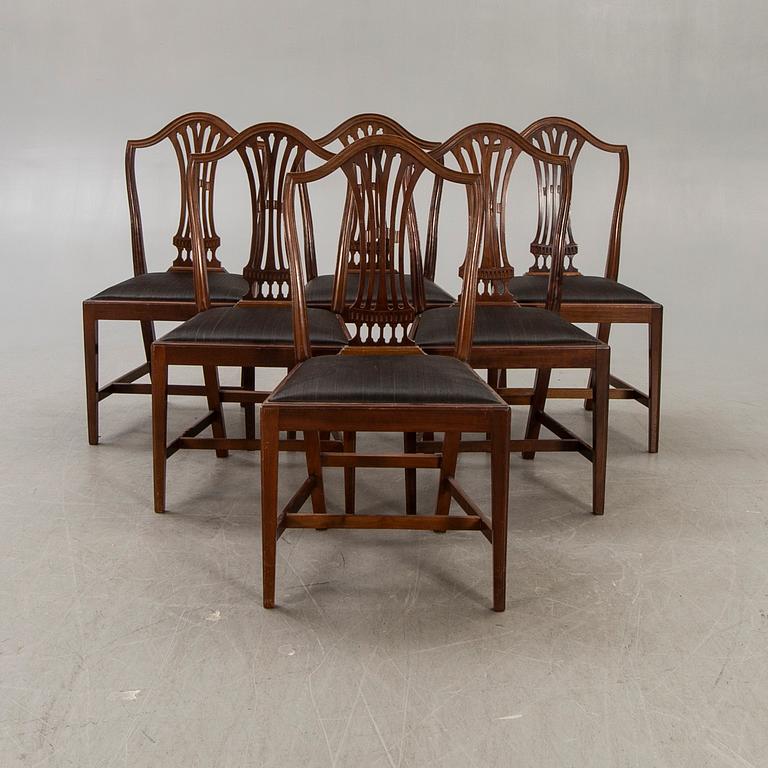 A set of six mahogany Hepplewhite style 20th century chairs.
