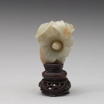 A celadon nephrite floral group, Qing dynasty (1644-1944).