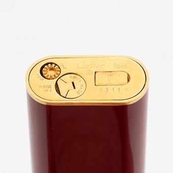 A Cartier lighter and pen.