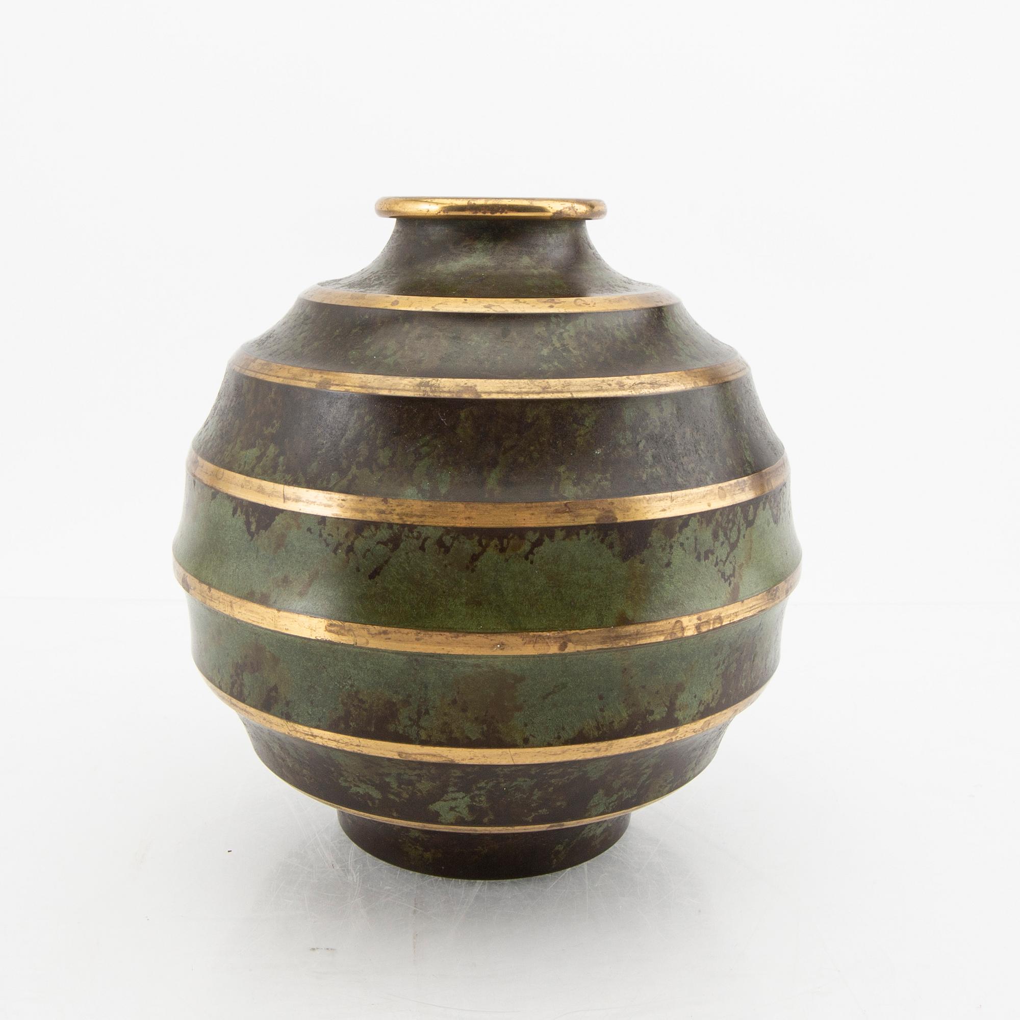 A 1930s metal vase.