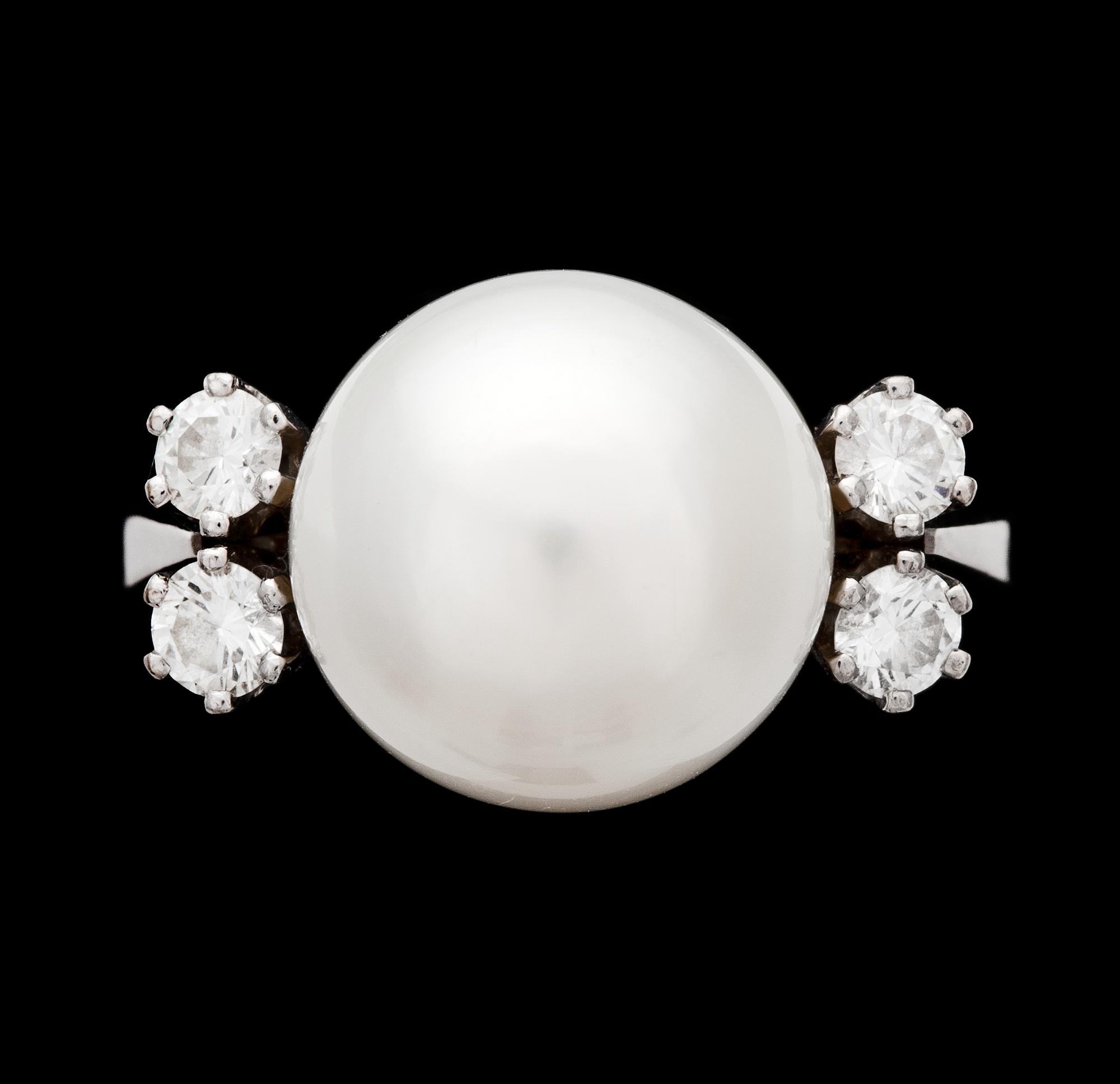 A cultured pearl, 12 mm, and diamond ring, 1980's.
