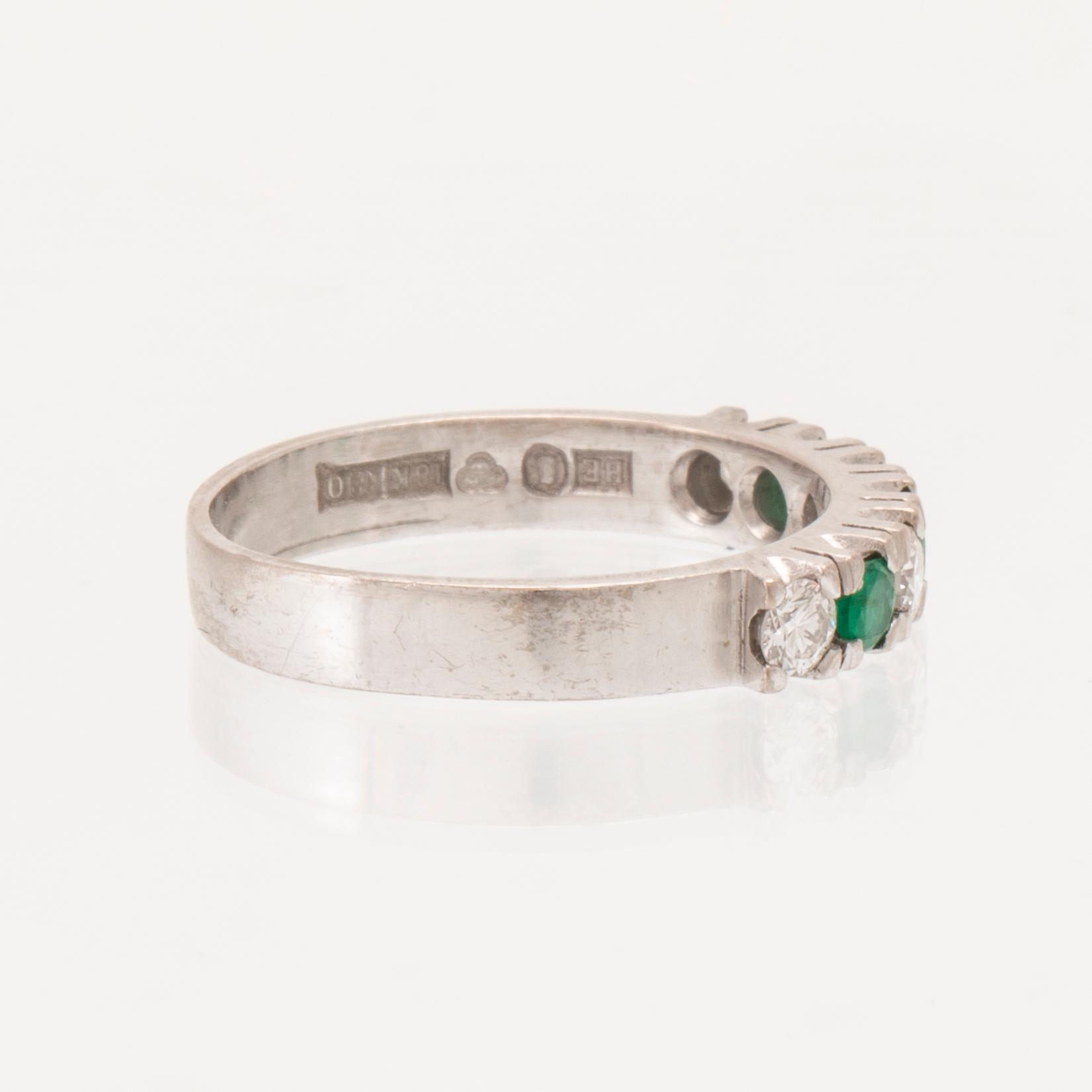 Ring half-eternity 18K white gold with round faceted emeralds and diamonds, Heribert Engelbert Stockholm 1981.