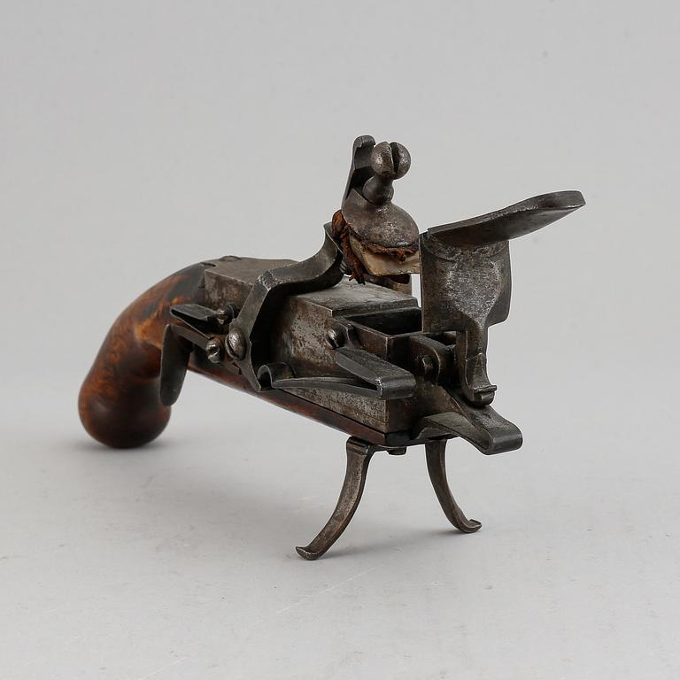 A 18th Century Flintlock lighter.